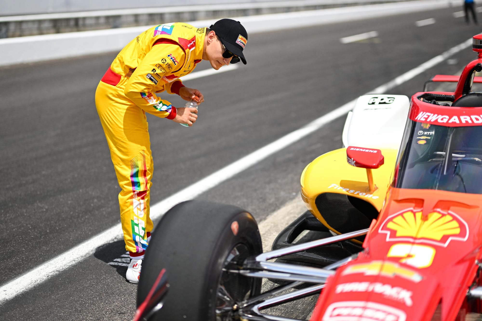 Alex Ballou looks at the IndyCar driven by Josef Newgarden
