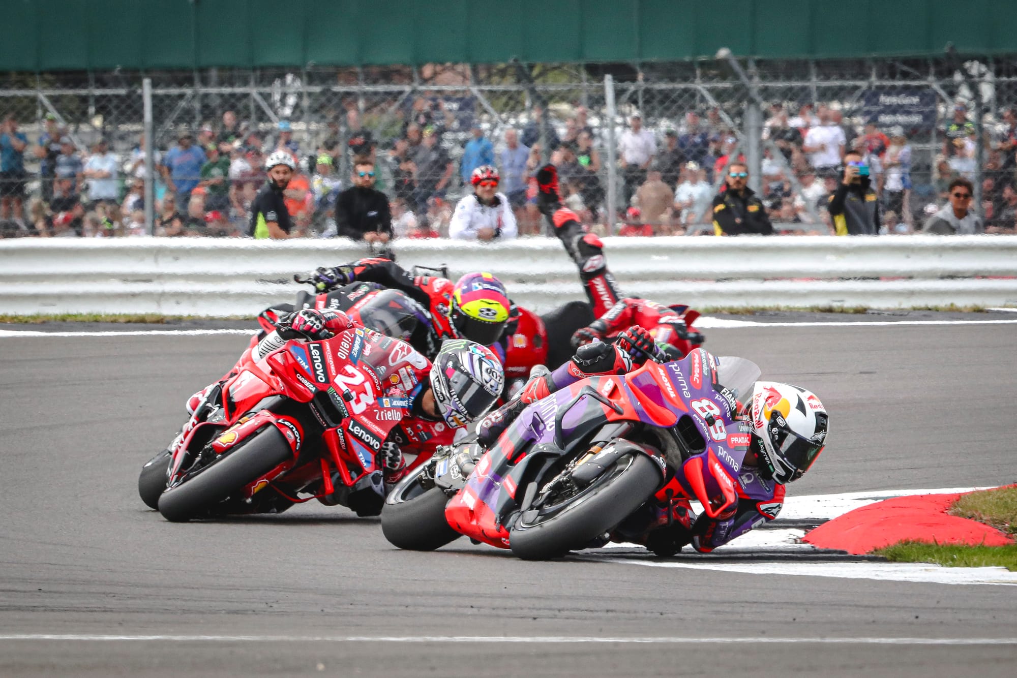 Jorge Martin, Enea Bastianini and Pecco Bagnaia take Turn 4 at MotoGP's British Grand Prix