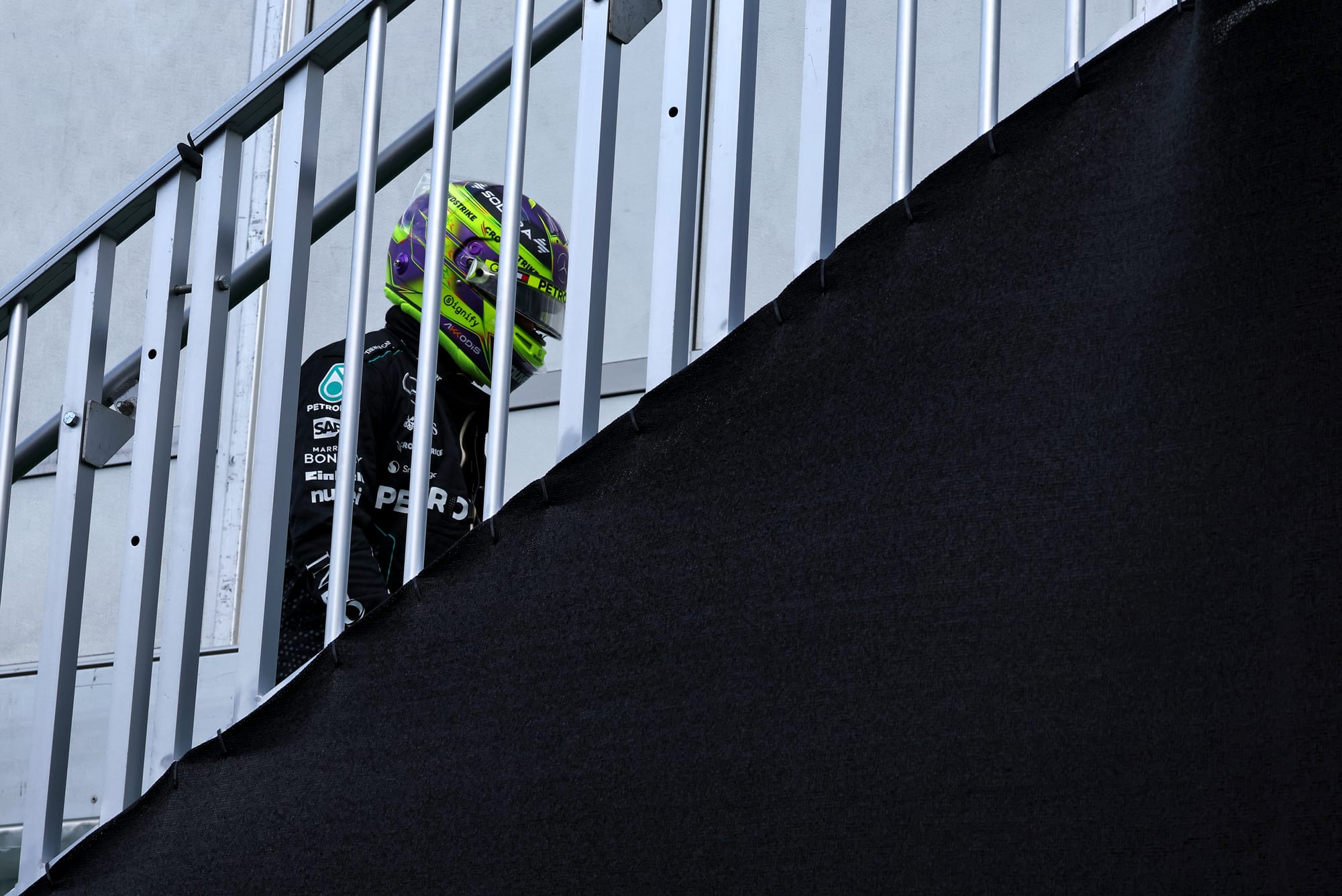 Lewis Hamilton climbs stairs after being eliminated from 2024 US GP qualifying