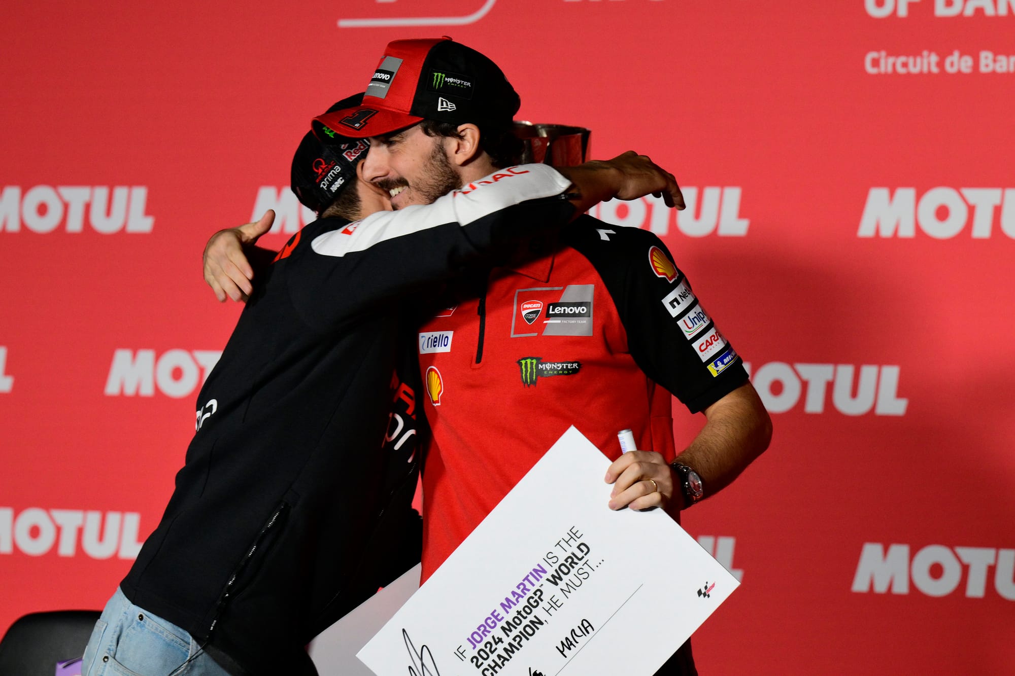 Jorge Martin and Pecco Bagnaia hug after the Thursday press conference in Barcelona