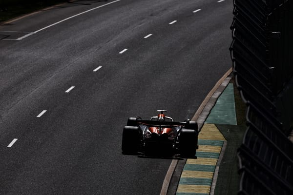 A McLaren in fading light at the Australian Grand Prix, 2024