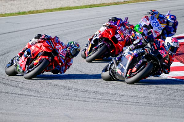 Enea Bastianini battles Aleix Espargaro during the Solidarity Grand Prix